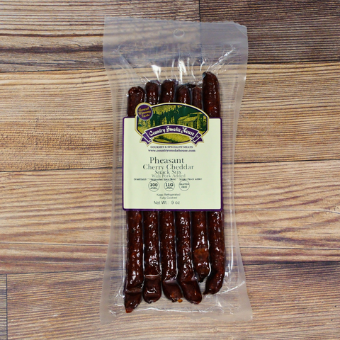 Pheasant Cherry Cheddar Snack Stix on a wooden background.