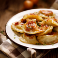 A plate of cooked Authentic Hamtramck Pierogi.