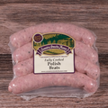 Packaged Polish Brats on a wooden background.