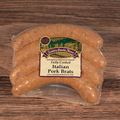 Packaged Italian Pork Brats on a wooden surface