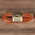 Packaged Roasted Kielbasa on a wooden surface