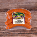 Packaged Roasted Polish Dogs With Cheese on a wooden surface
