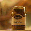 Jar of Salsa Verde on a wooden surface