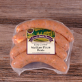Packaged Sicilian Pizza Brats on a wooden background.