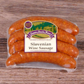 Packaged Slovenian Wine Sausage on a wooden background.