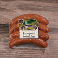 Packaged Smoked European Dogs on a wooden surface