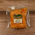 Packaged Southern Style Hand Pulled Chicken on a wooden surface