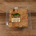 Packaged Southern Style Pulled Pork on a wooden surface