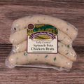 Packaged Spinach Feta Chicken Brats on a wooden surface.