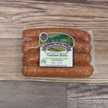 Packaged Stadium Brats on a wooden surface.