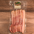 Packaged State Champion Premium Sugar Cured Smoked Bacon on a wooden surface