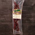 Packaged steak cut beef teriyaki jerky with a label on a wooden surface
