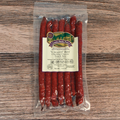 Packaged Uncured Beef Cheddar Cheese Snack Stix on a wooden surface