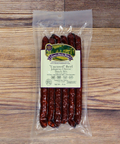 Packaged Uncured Beef Jalapeno Cheese Snack Stix on a wooden background