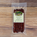 Packaged Uncured Beef Jalapeno Cheese Snack Stix on a wooden background
