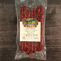 Packaged Uncured Venison Mild Snack Stix on a wooden surface