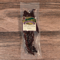 Packaged Venison Teriyaki Jerky on a wooden surface