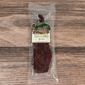 Venison BBQ jerky package on a wooden surface