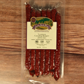 Packaged Venison Carolina Reaper Snack Stix on a wooden surface