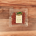 Packaged Venison Hunters Sausage on a wooden surface