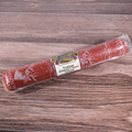 Packaged Venison Jalapeno Cheese Long Salami on a wooden surface.
