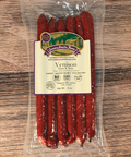 Packaged venison mild snack stick with a label on a wooden surface