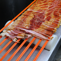 Bacon being sliced