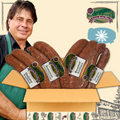 A variety pack of Steve's Kielbasa sausages displayed in an open box with a man smiling in the background.